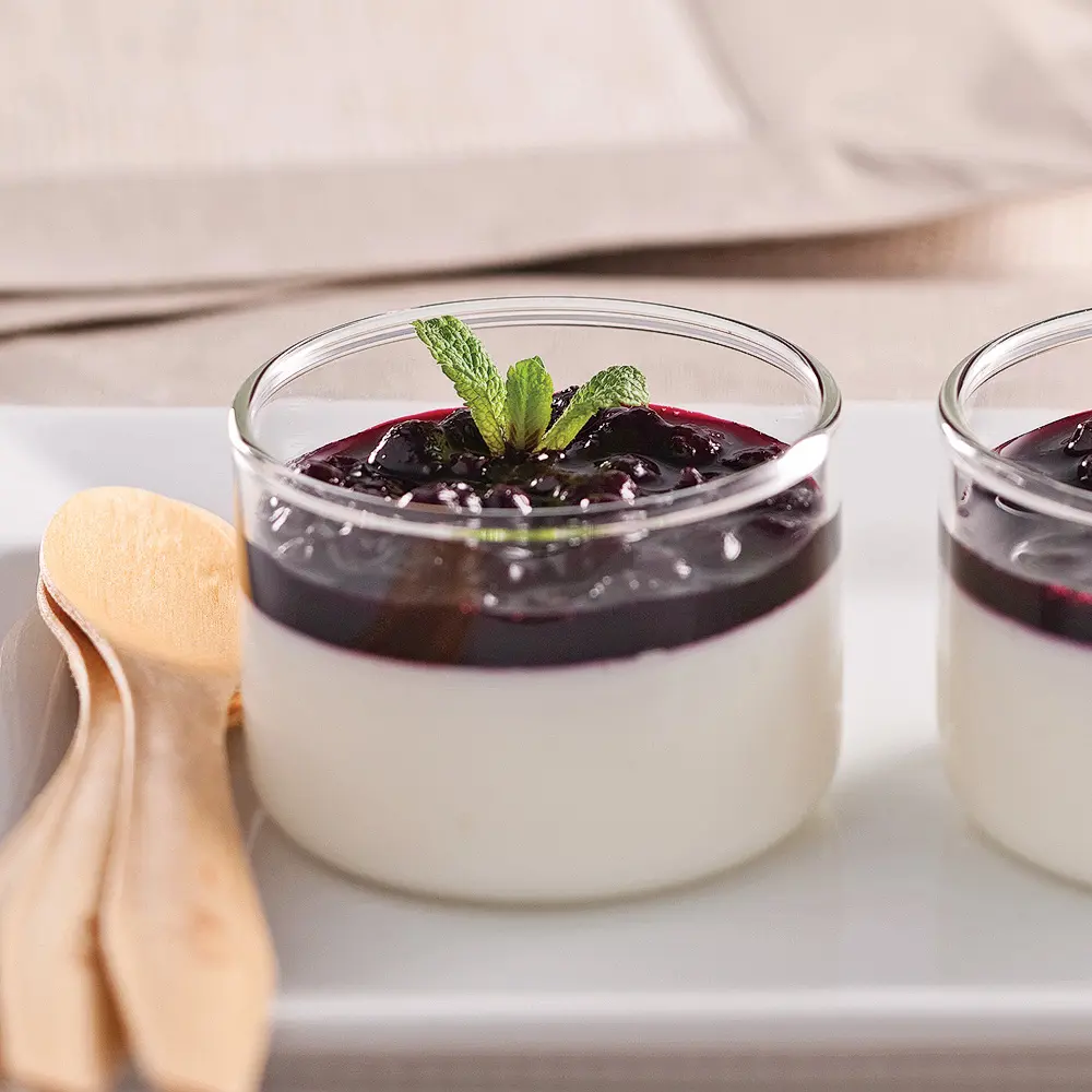 Yogurt panna cottas with blueberries coulis