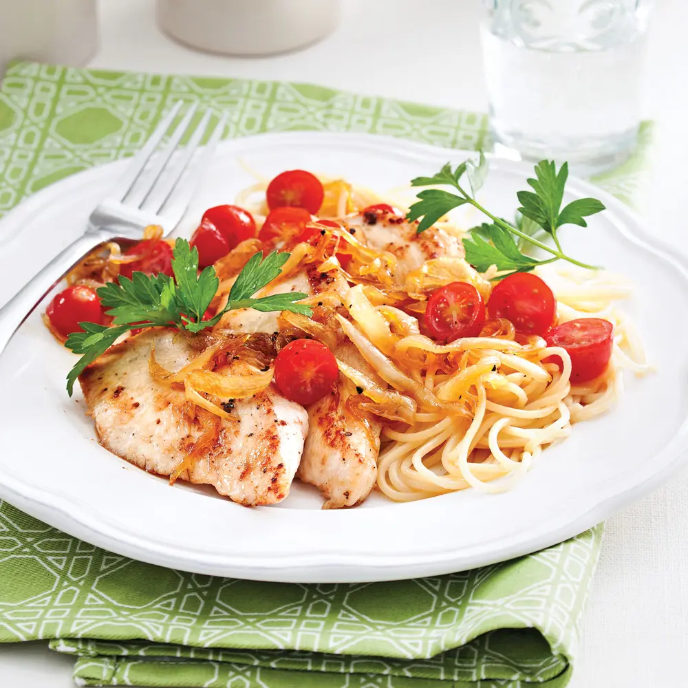 Chicken cutlets with caramelized onions over pastas