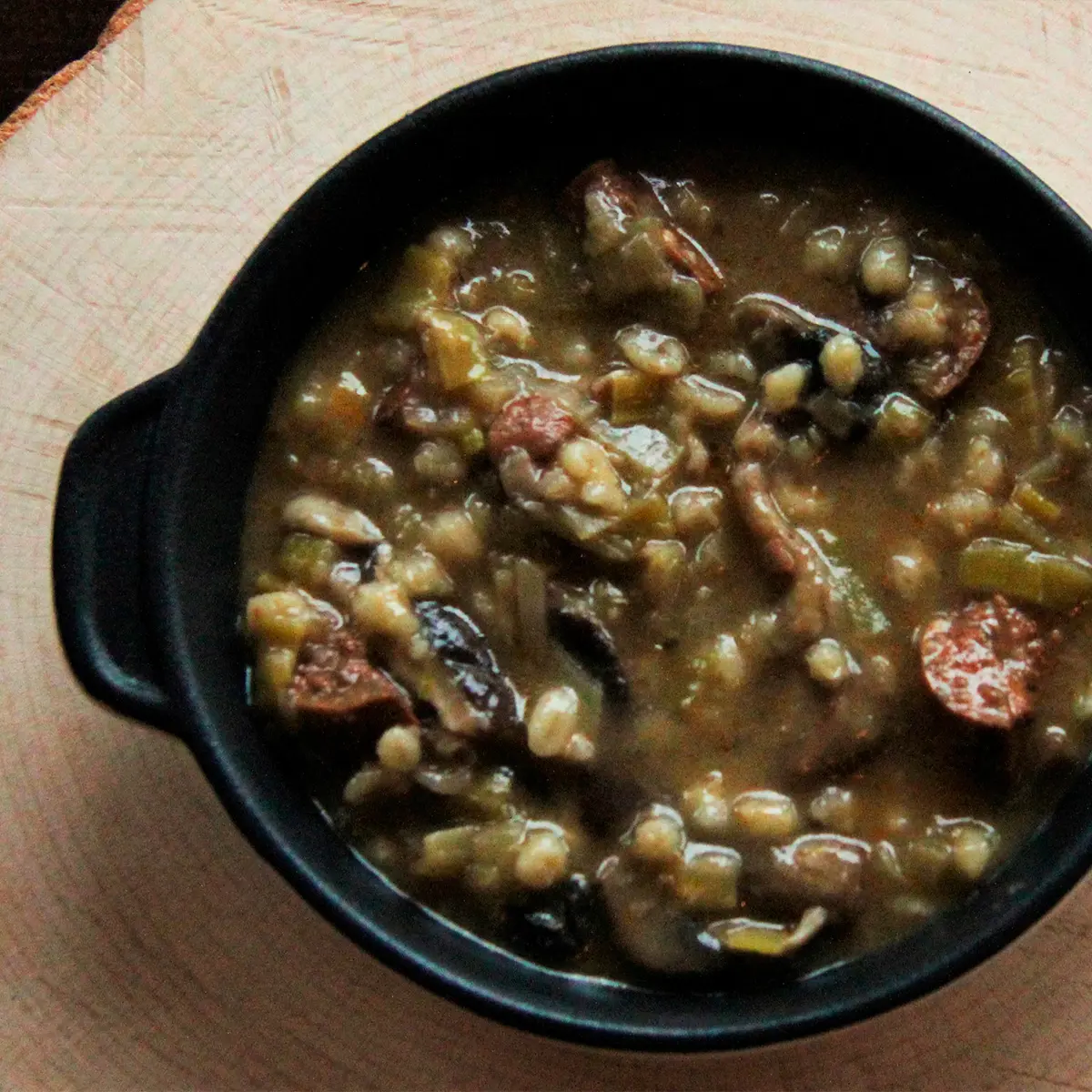 Shiitake mushrooms, sausages and leeks soup