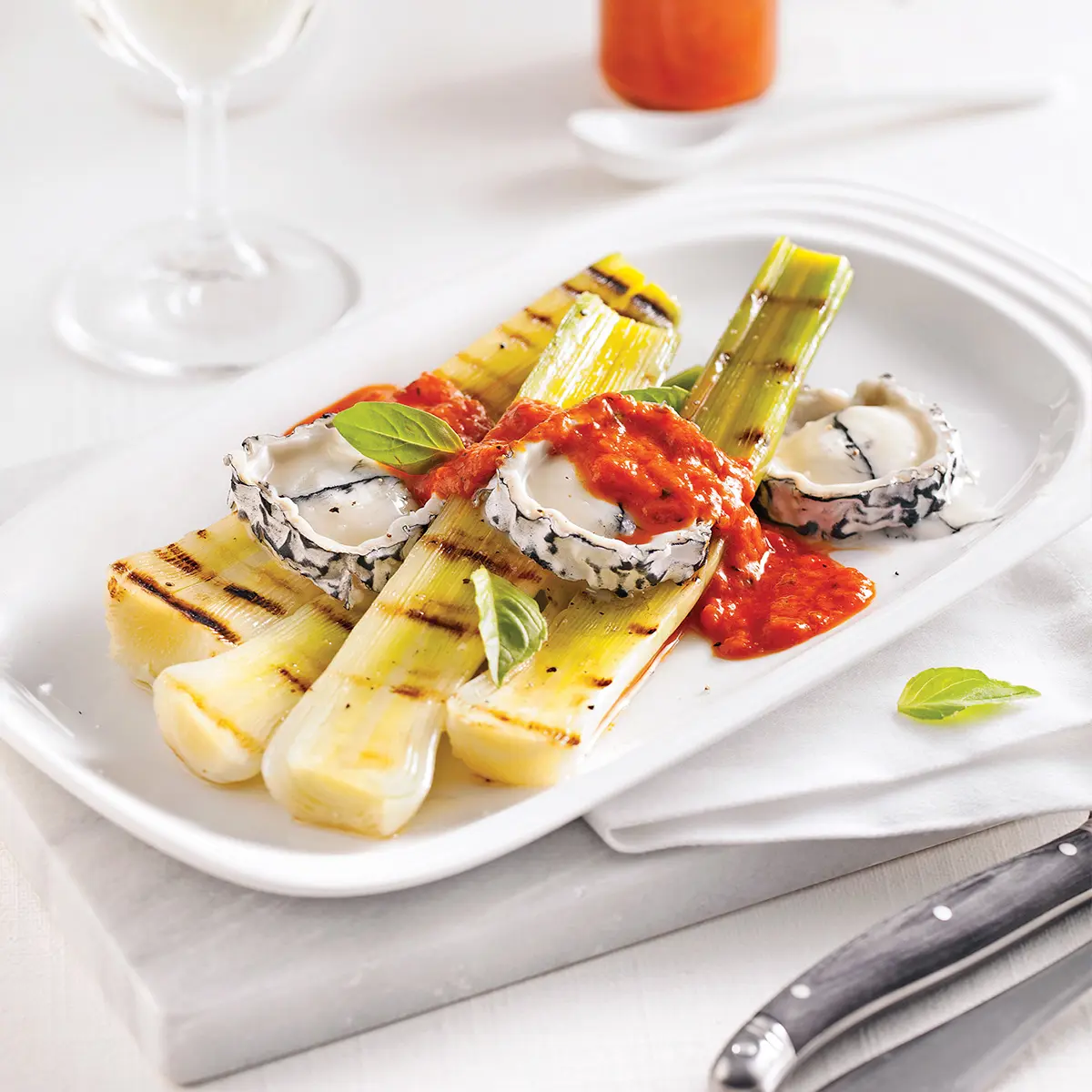 Leeks with goat cheese and red peppers