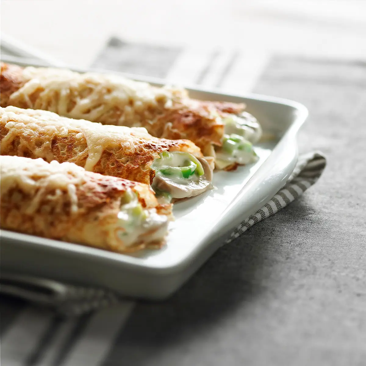 Stuffed crepes with leeks and mushrooms