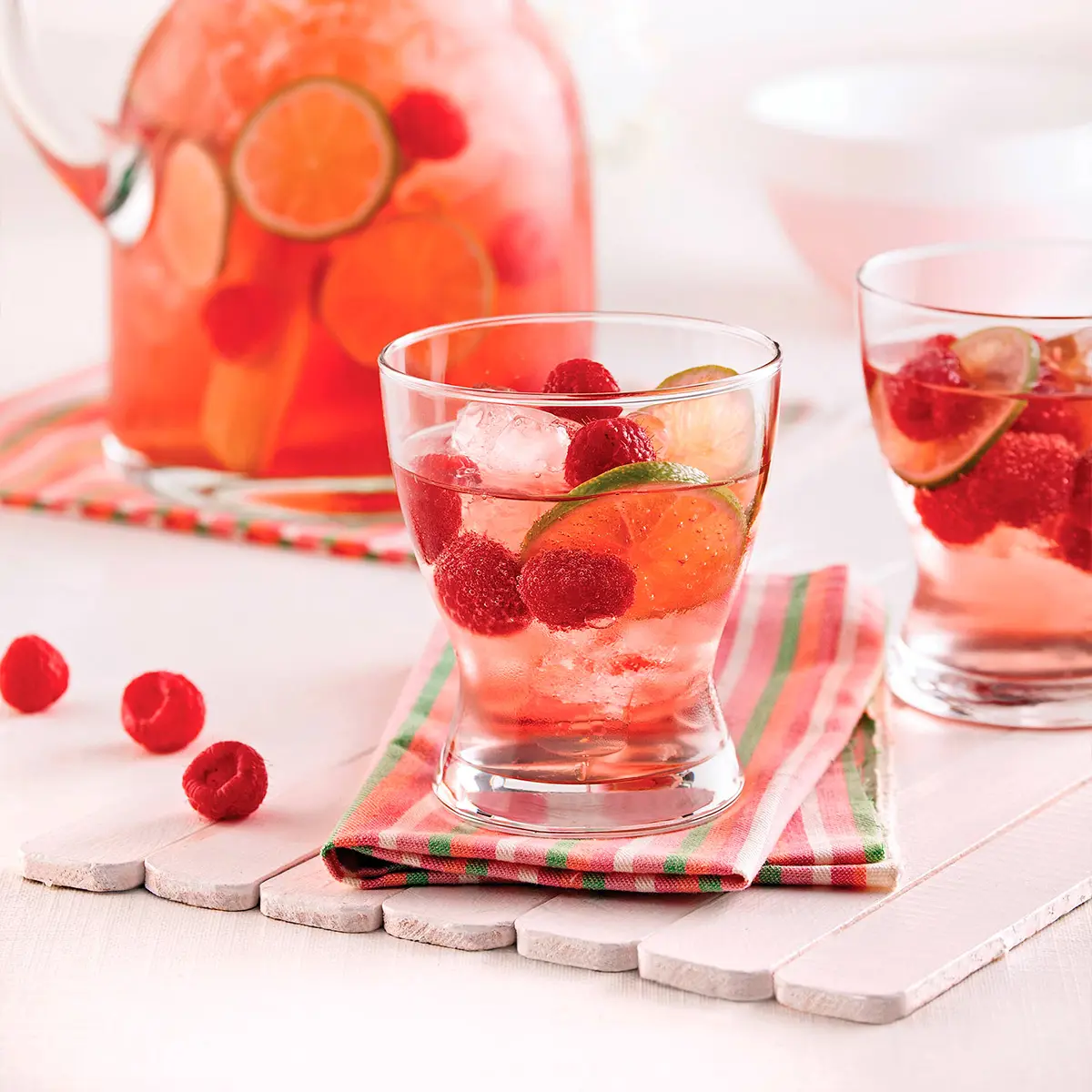Rosé punch with limes and raspberries